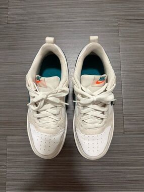 Nike Kids White Cream Sneakers with Teal and Orange Accents